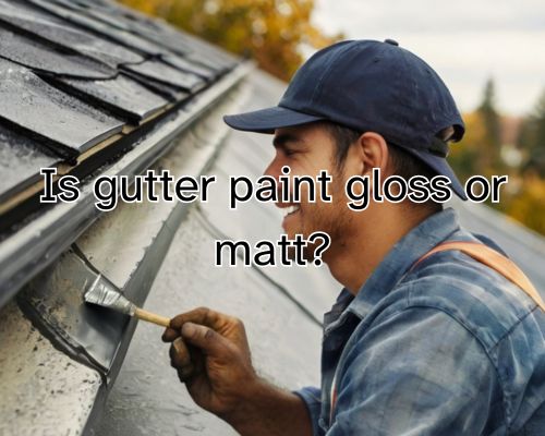 worker painting the gutter gray
